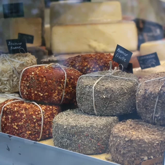 An array of herb wrapped cheeses