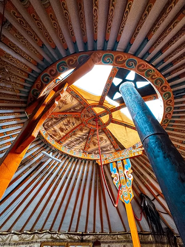 Exterior of a colorful Mongolian ger set against the steppe landscape