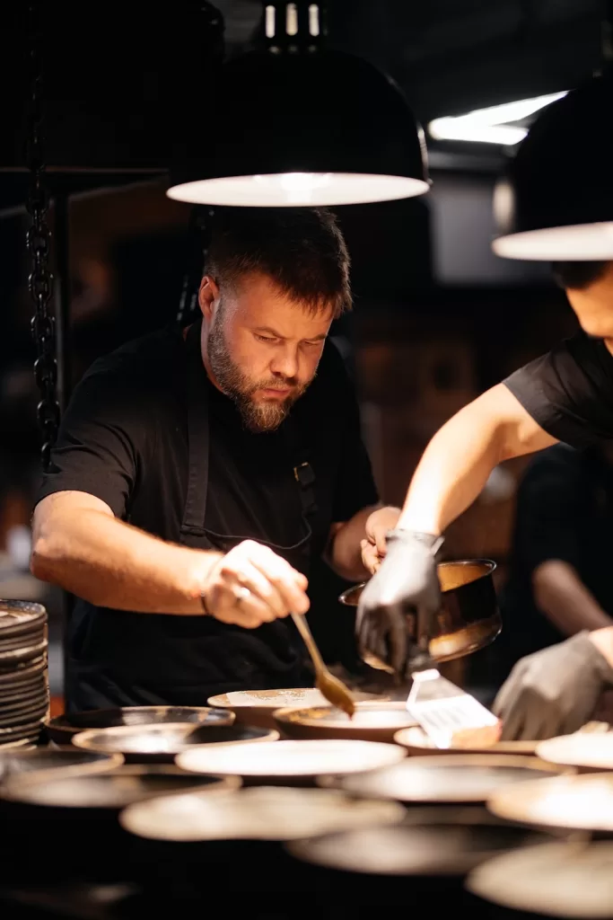 Auyl's head chef, Ruslan Zakirov, presiding over the open kitchen.