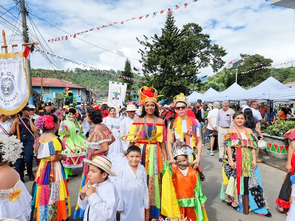 A colorful group gathers in traditional clothes during the independence day parade. Photo courtesy of iStock/Markpittimages