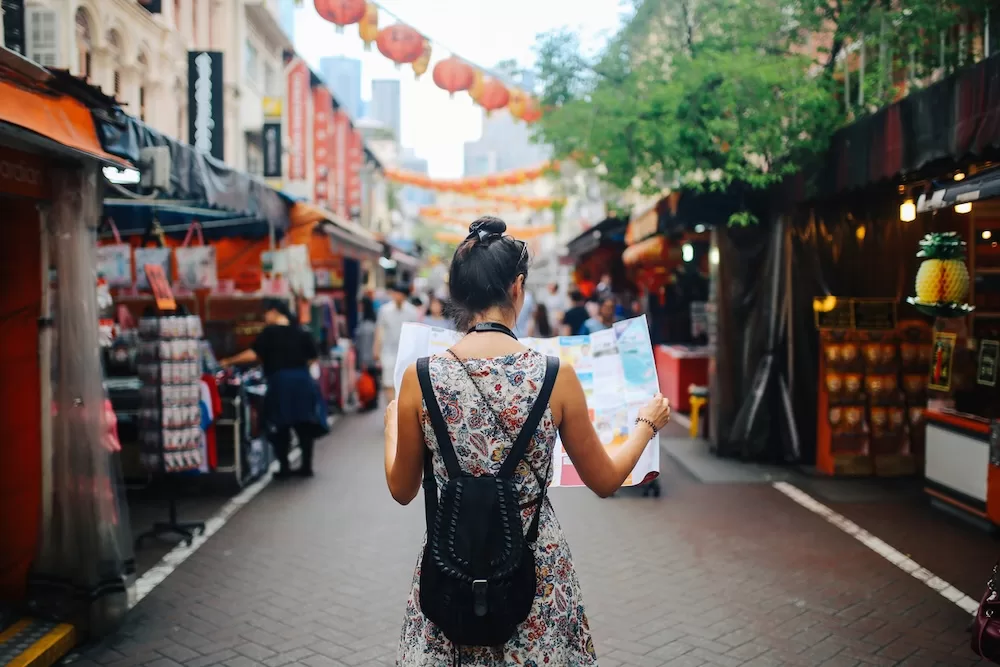 A young woman navigates a new city. Photo courtesy of iStock/lechatnoir.