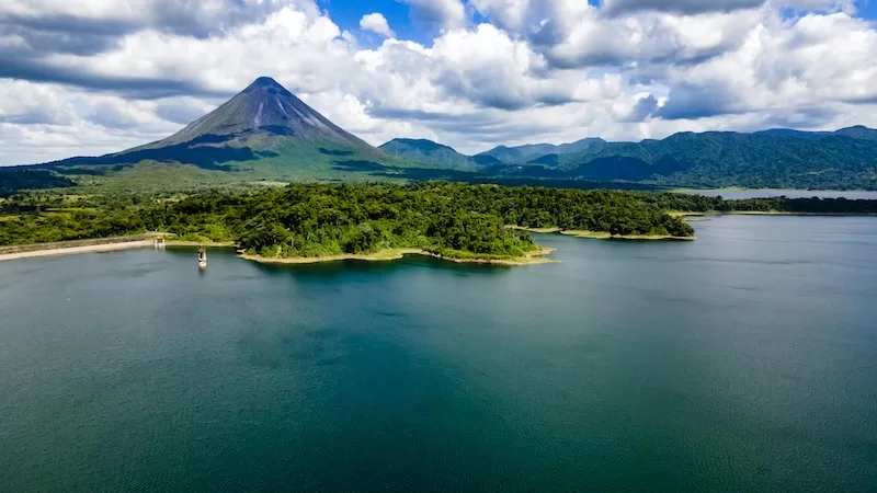 Arenal Volcano National Park, with Arenal Lake in the foreground.